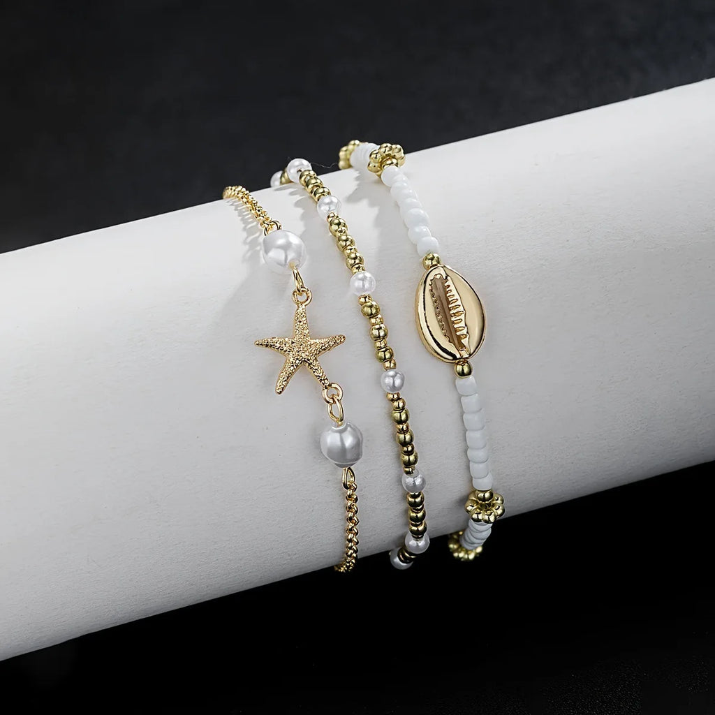 Chaînes de cheville de Style bohème pour femmes, accessoires de pied à trois couches avec perles de riz, coquillages et étoile de mer
